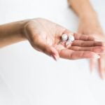 pearl earring in hands